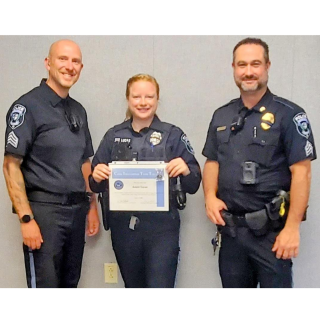 Officers pose for a group photo.